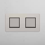 Dual Control Light Switch: Double Rocker Switch in Polished Nickel Black on White Background