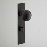 Poplar Long Plate Sprung Door Knob & Thumbturn Bronze Finish on White Background at an Angle