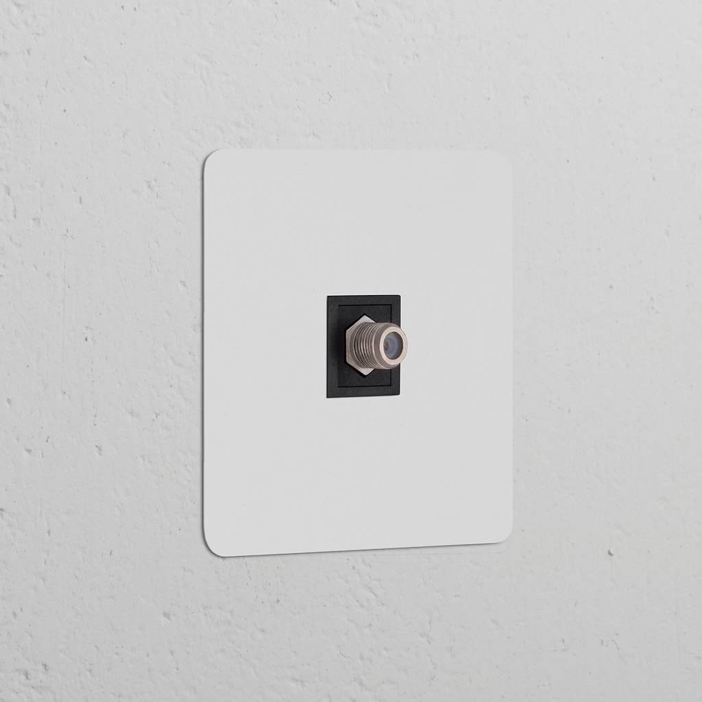 Paintable black single satellite module with a coaxial connector, ideal for integrated socket installations.
