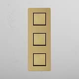 Three Position Vertical Rocker Switch in Antique Brass Black on White Background