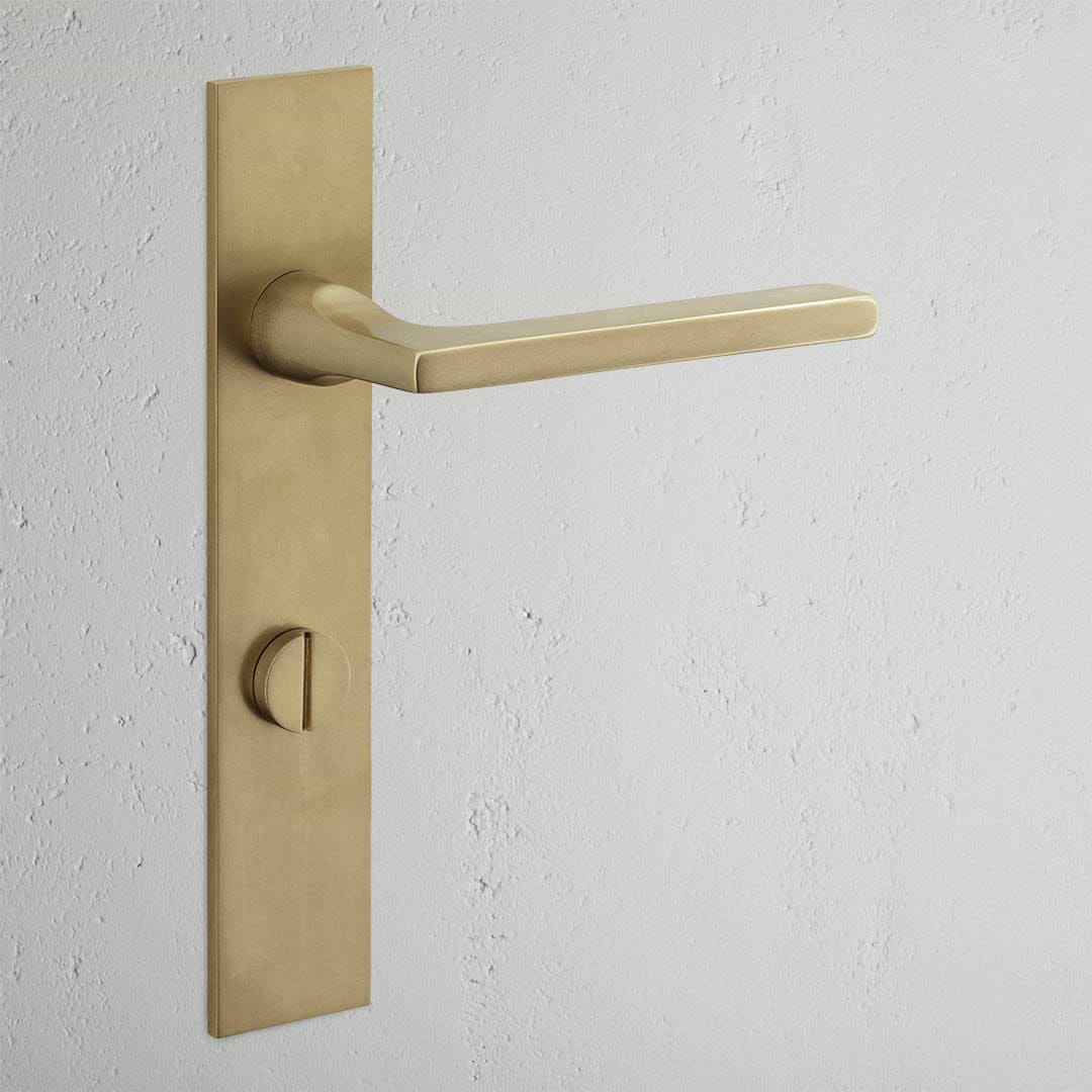 Clayton Long Plate Sprung Door Handle & Thumbturn Antique Brass Finish on White Background