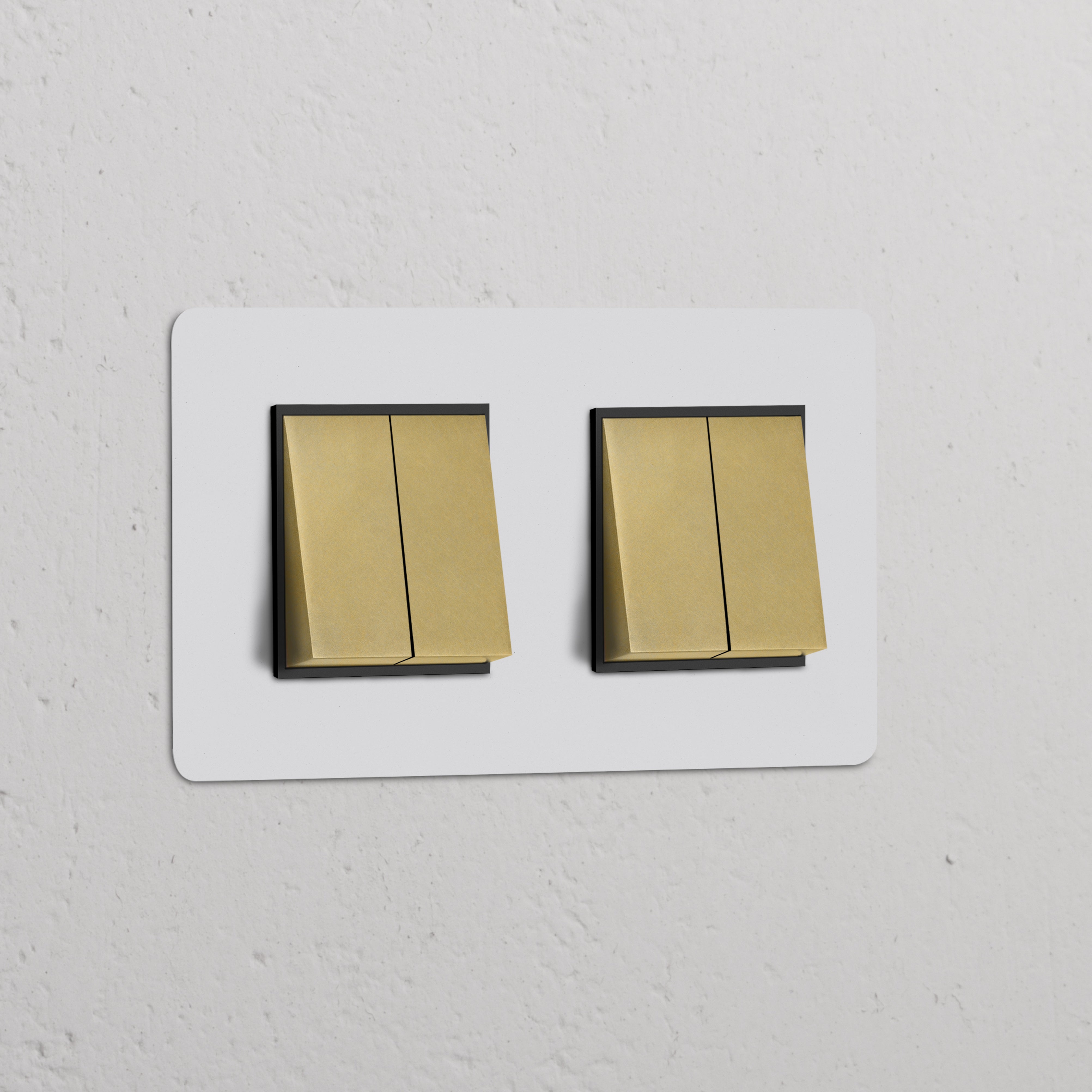 Paintable antique brass Double 4x Rocker Switch with black features on a white textured wall.