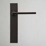 Clayton Long Plate Sprung Door Handle Bronze Finish on White Background Front Facing