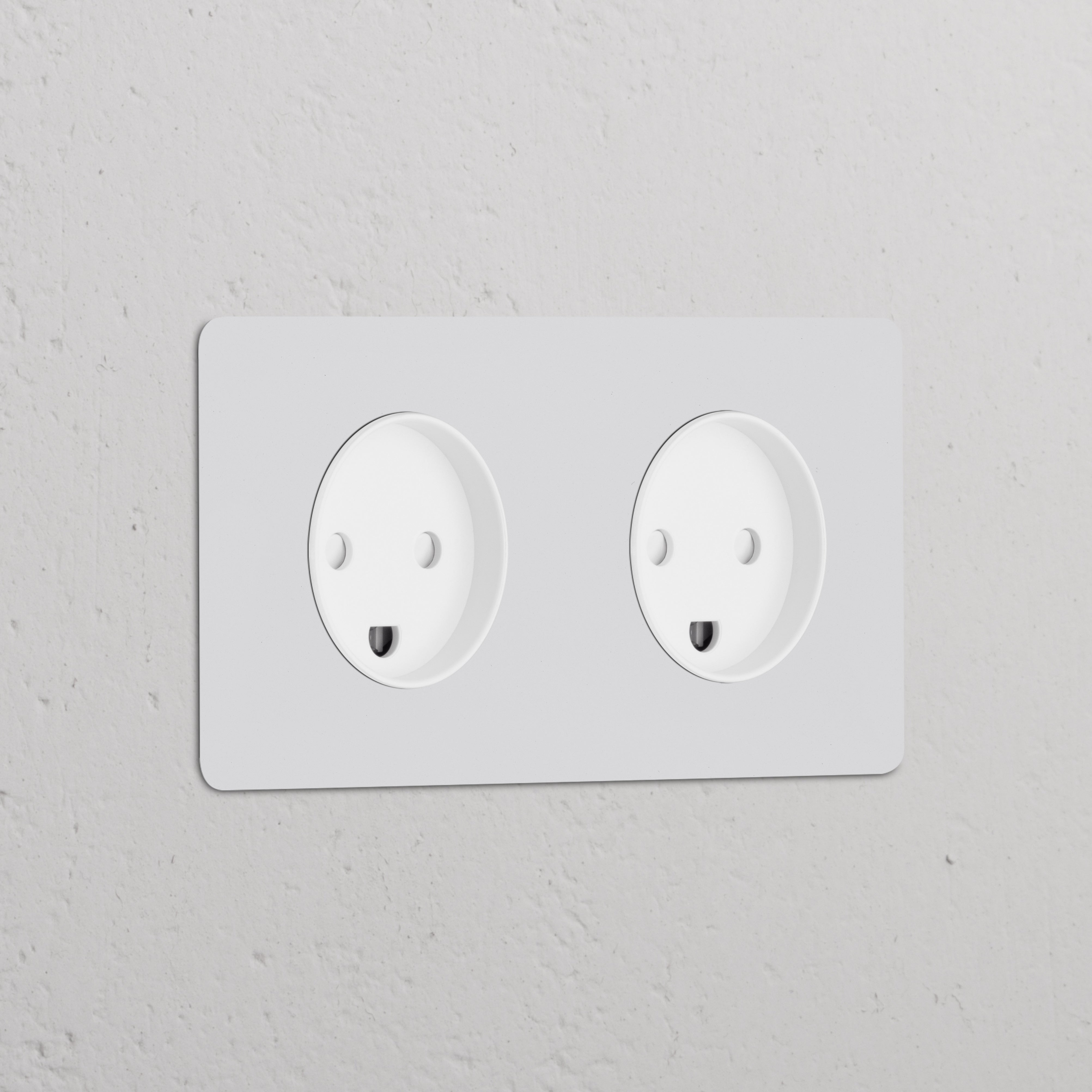 Double 2x Danish Type K round paintable white power module with two sockets for electrical use.