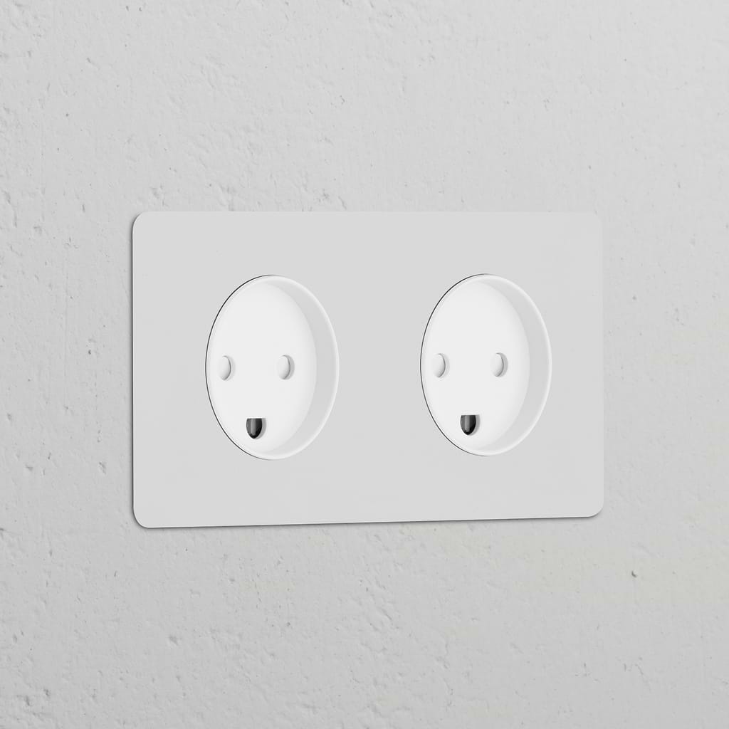 Double 2x Danish Type K round paintable white power module with two sockets for electrical use.
