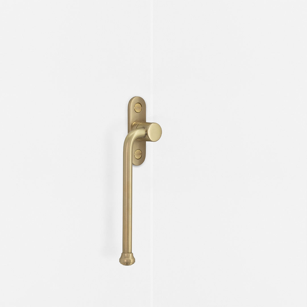 Left Southbank Casement Window Handle Antique Brass Finish on White Background