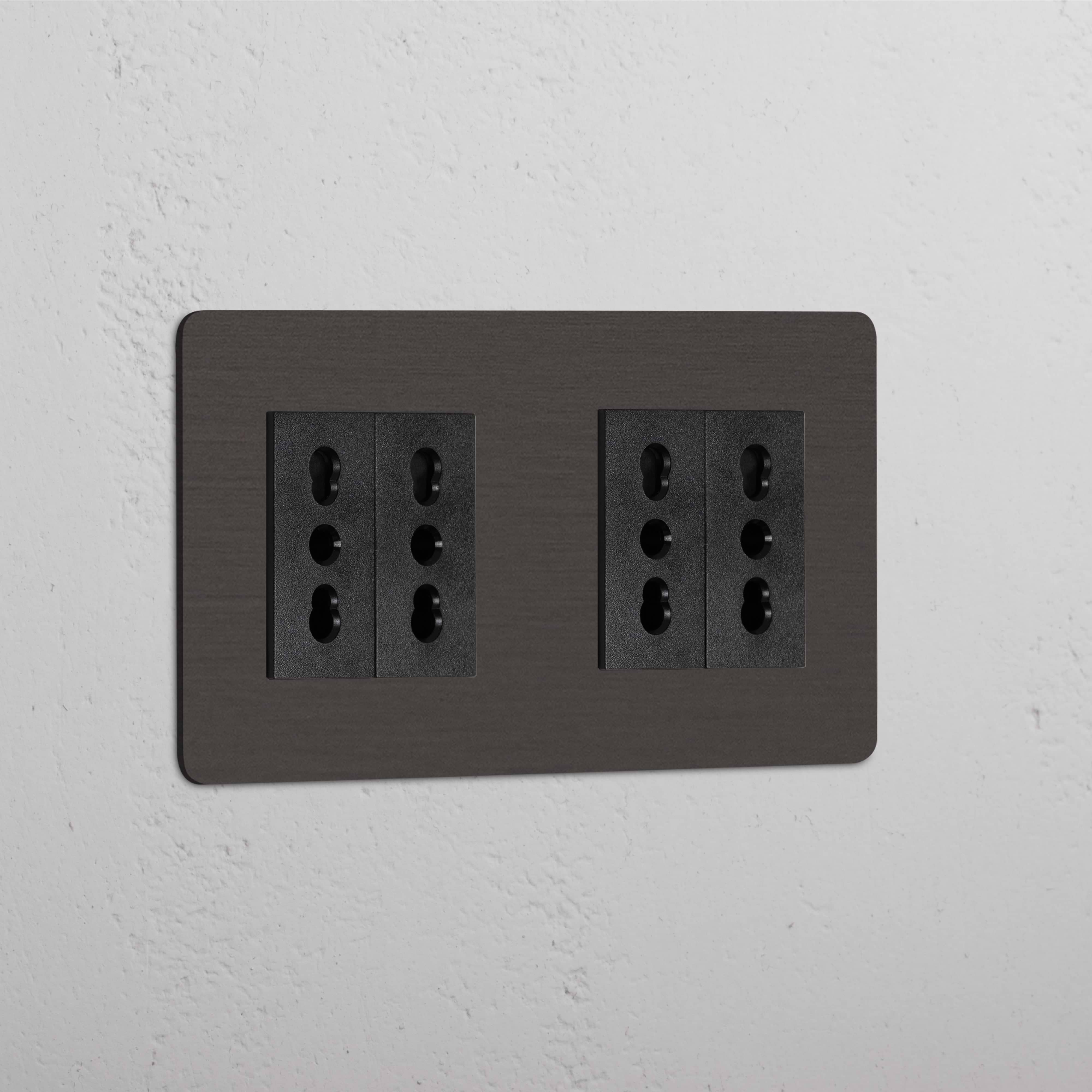 Double 4x Bipasso Module - Bronze Black, Double Sockets & Modules on a white textured wall.