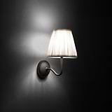 Small Malvern Wall Light in Alabaster White at an angle and turned on at night