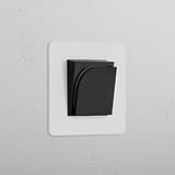 Single Hotel Key Card Switch Paintable Black on white textured wall, part of Single Sockets & Modules collection.