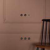 Triple Toggle Switch + 2x Swiss Type J Power Module in paintable bronze black for functional, elegant wall installations.