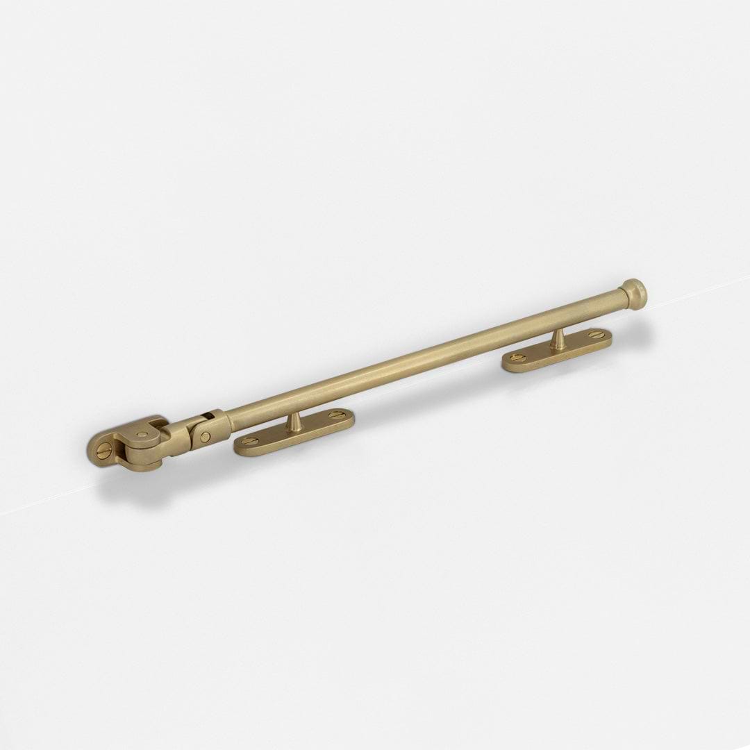 Southbank Casement Window Stay 275mm Antique Brass Finish on White Background