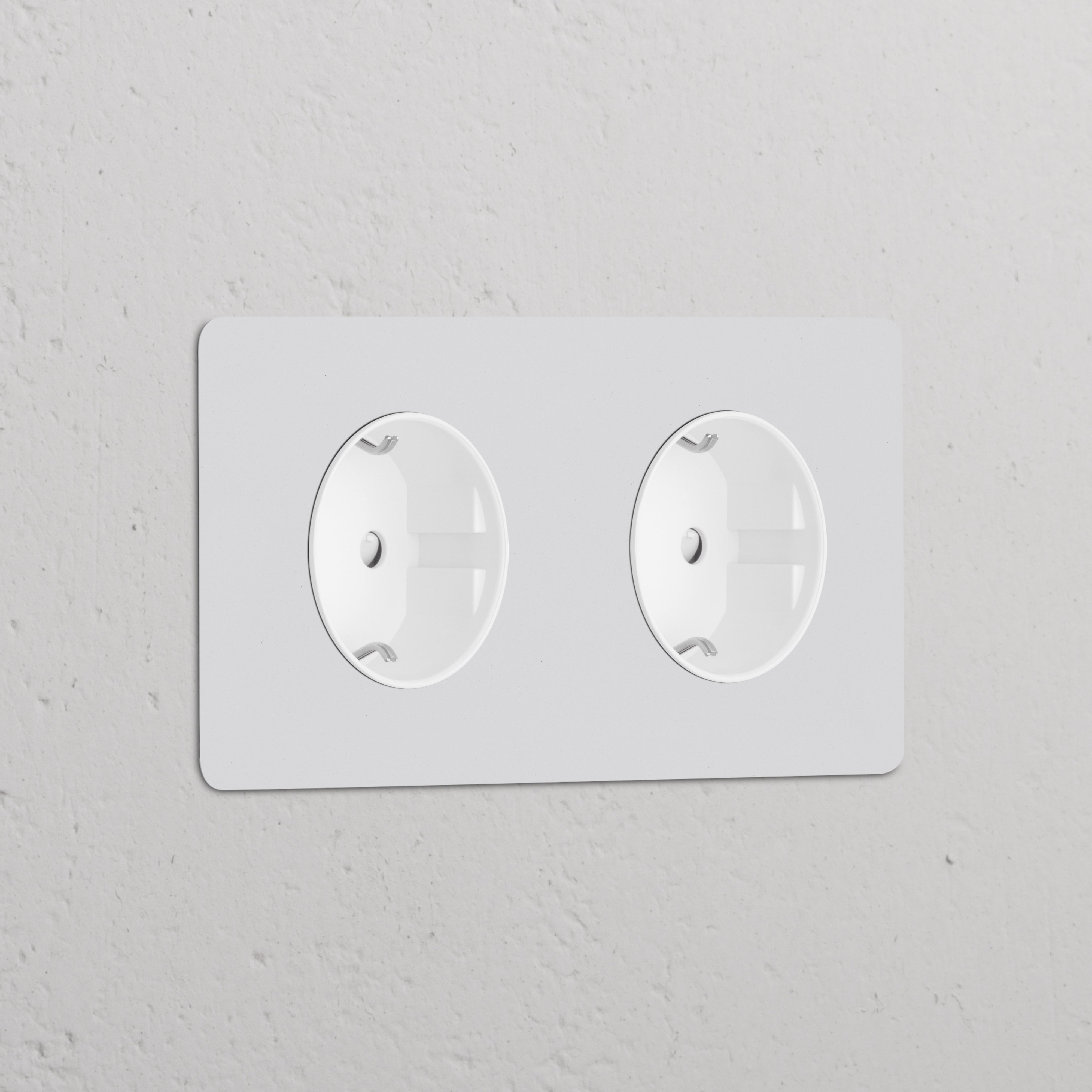 Double 2x Schuko Type F power module in paintable white, designed as a round dual socket for wall installation.