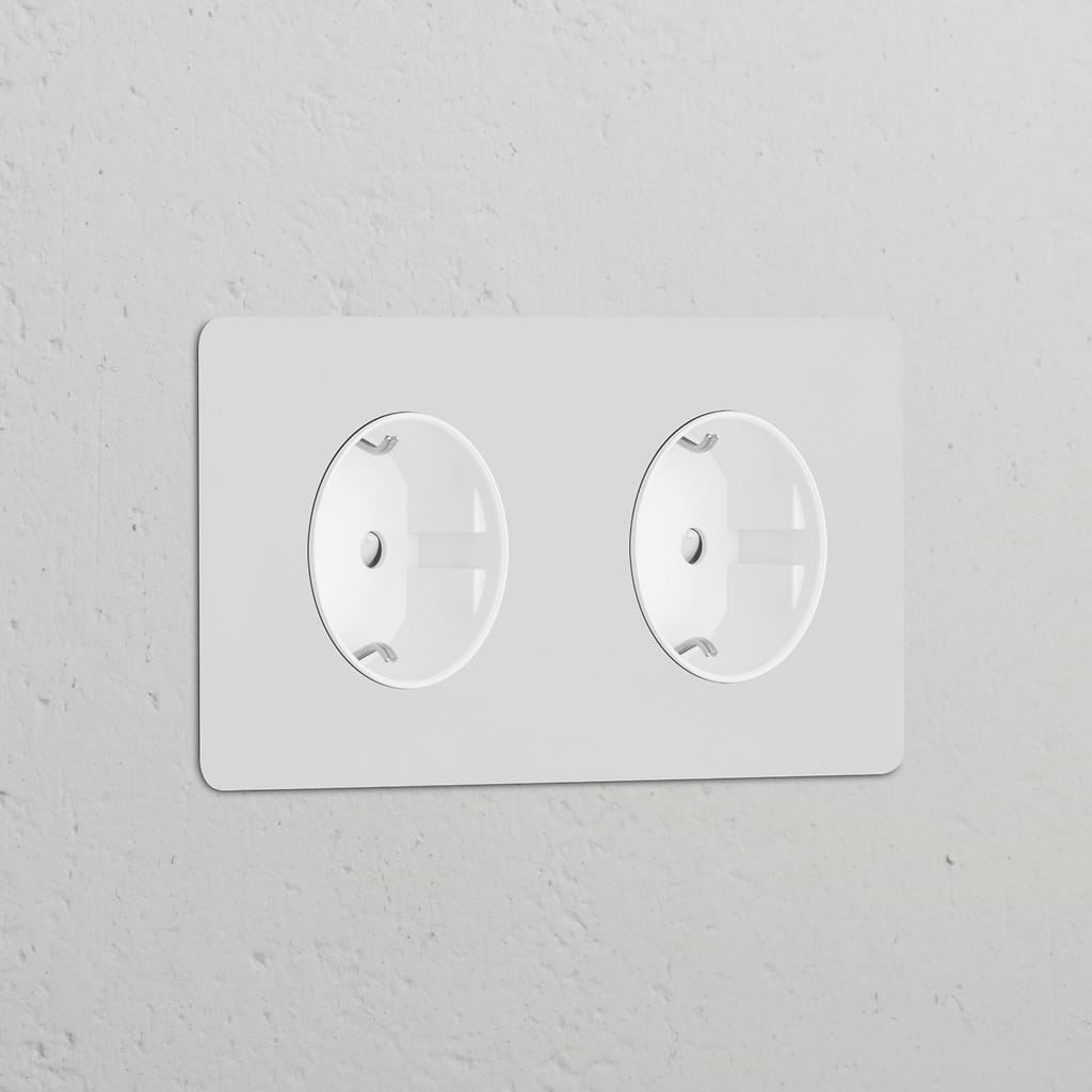 Double 2x Schuko Type F power module in paintable white, designed as a round dual socket for wall installation.