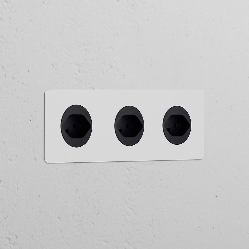 Triple 3x Swiss Type J paintable black power modules in a sleek, round design for seamless wall integration.