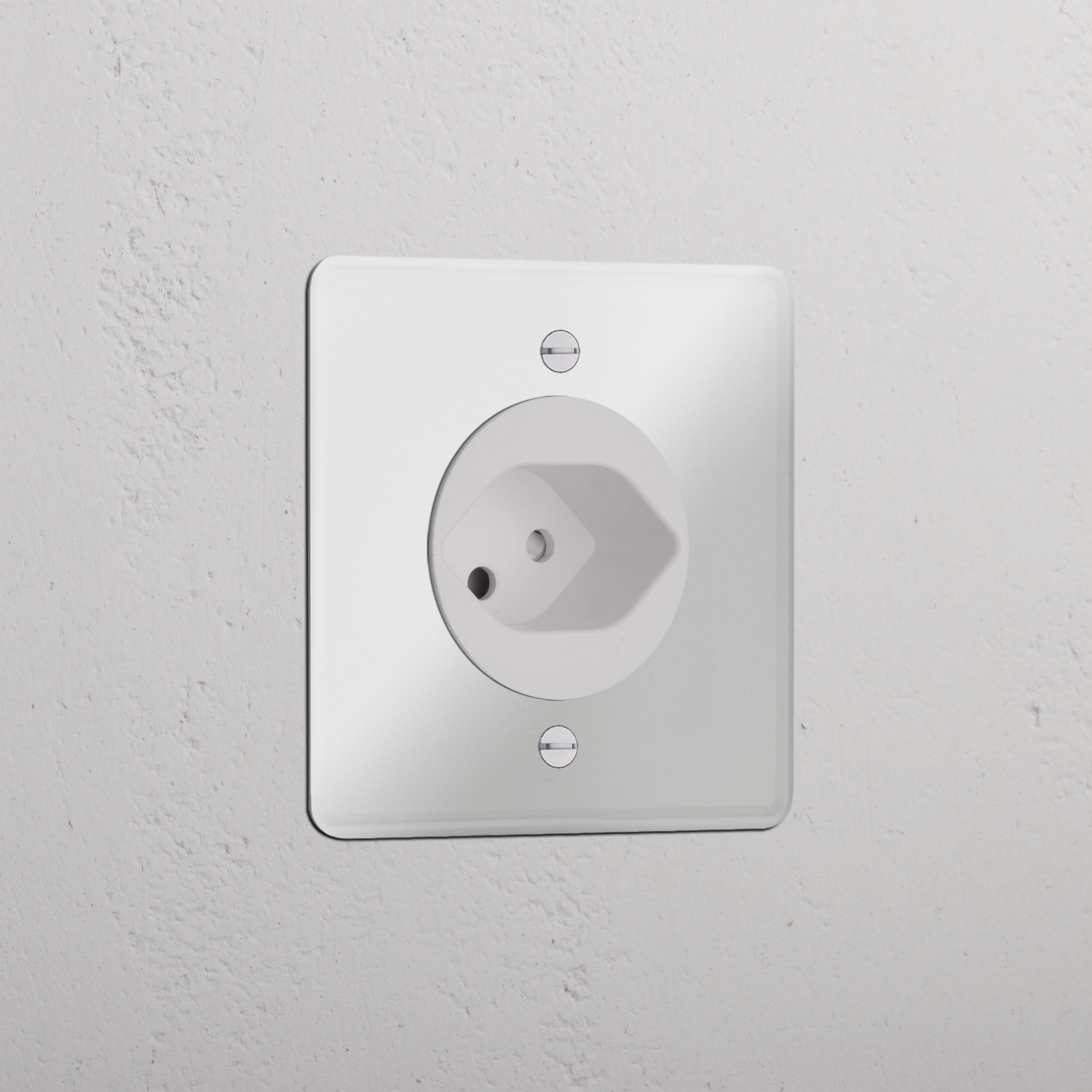 Clear white single Swiss module round socket set in a textured white wall, suitable for electrical outlets.