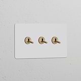 Double 3x toggle switch on a paintable antique brass panel for double switches & dimmers.