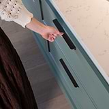 Oxford Edge Pull Handle 384mm Bronze Finish on White Background affixed to a dark green kitchen draw with marble top