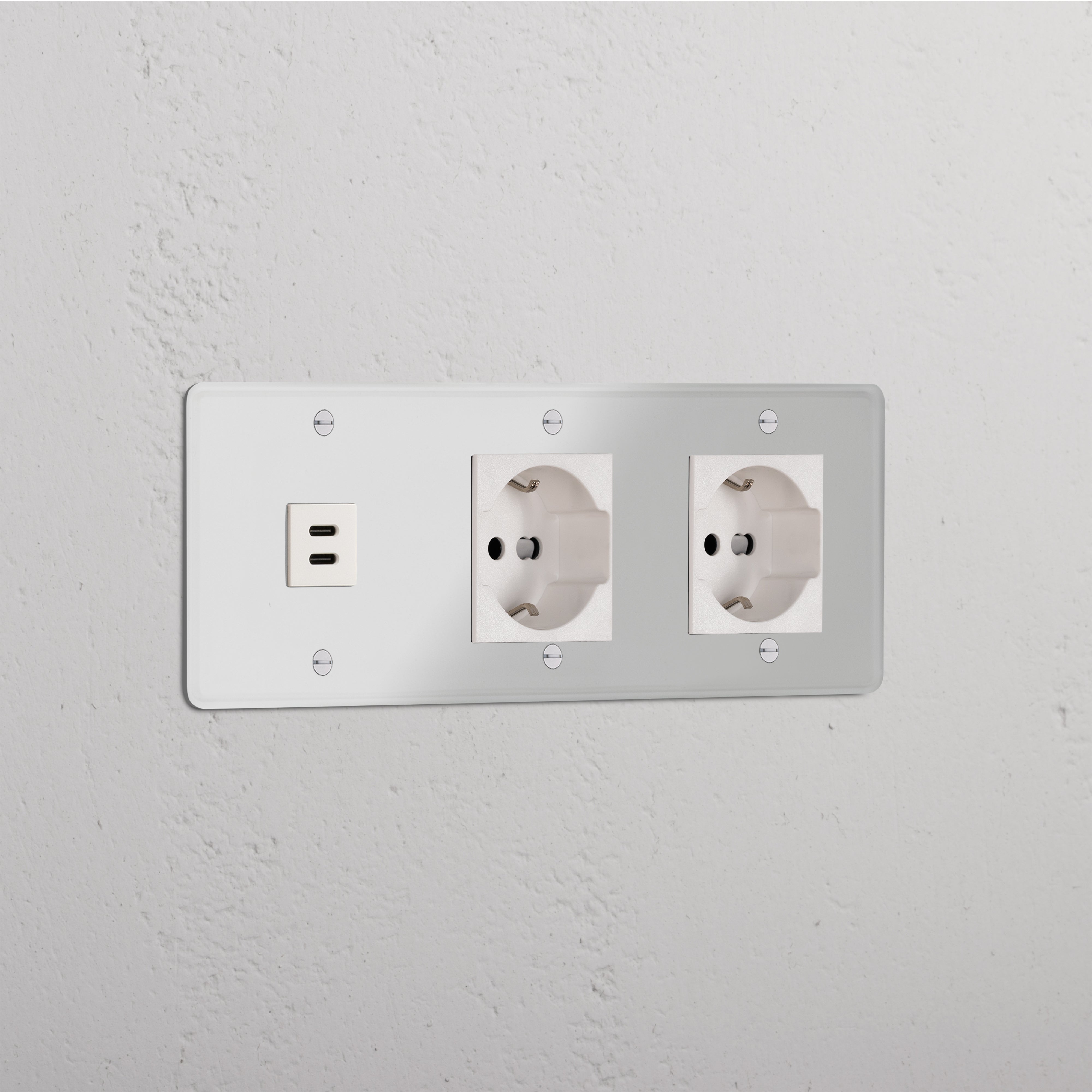 Clear White Triple USB 30W & 2x Schuko/Bipasso Module for electrical sockets, shown on a white wall.