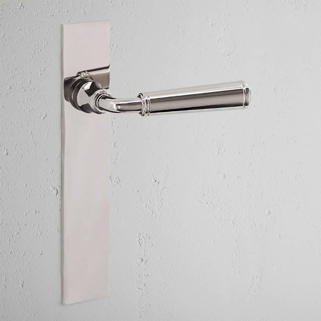 Digby Long Plate Sprung Door Handle Polished Nickel Finish on White Background 