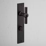 Harper T-Bar Long Plate Sprung Door Handle & Thumbturn Bronze Finish on White Background at an Angle