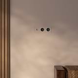 Triple Toggle Switch + 2x Schuko Type F Power Module Round in polished nickel black on wall, enhancing decor.