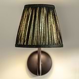 Small Malvern Wall Light in Deep Green front facing close up of pleated shade and turned on
