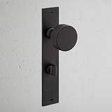 Onslow Long Plate Sprung Door Knob & Thumbturn Bronze Finish on White Background at an Angle