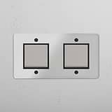 Sleek Double Rocker Switch in Clear Polished Nickel Black for Lighting Control on White Background