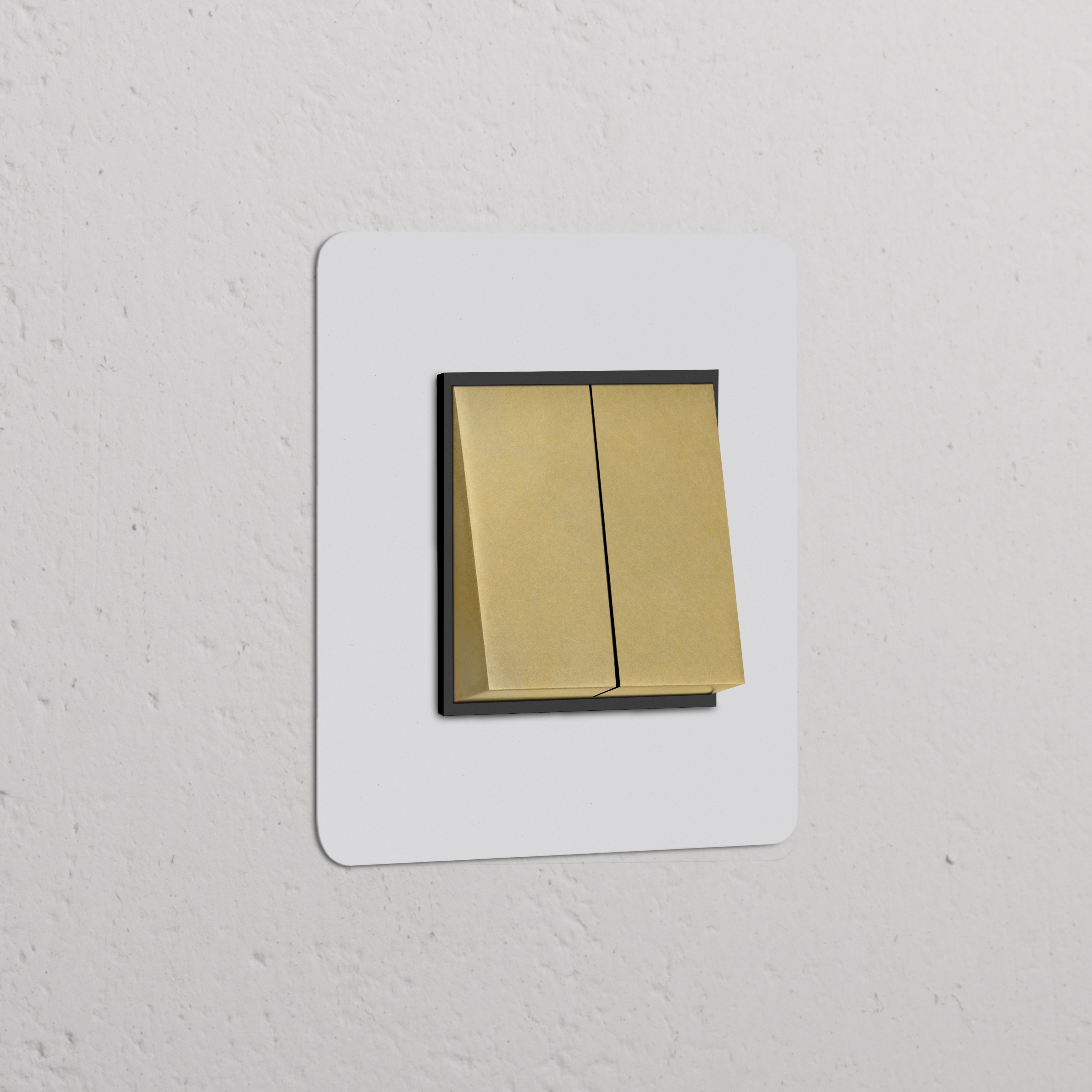 Single 2x Rocker Switch in paintable antique brass black finish on a white textured wall.