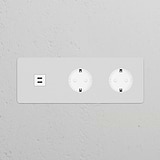 Round white power module with two Schuko Type F sockets and Triple USB 30W ports, paintable for customization.
