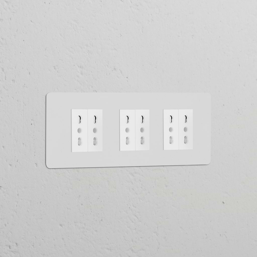 Triple 6x Bipasso Power Module in paintable white with three sockets, blends into the wall for a seamless look.