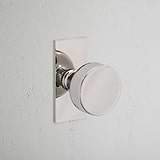 Onslow Short Plate Sprung Door Knob Polished Nickel Finish on White Background