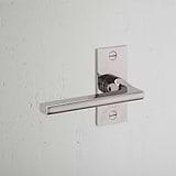 Clayton Short Plate Sprung Door Handle Polished Nickel Finish on White Background at an Angle