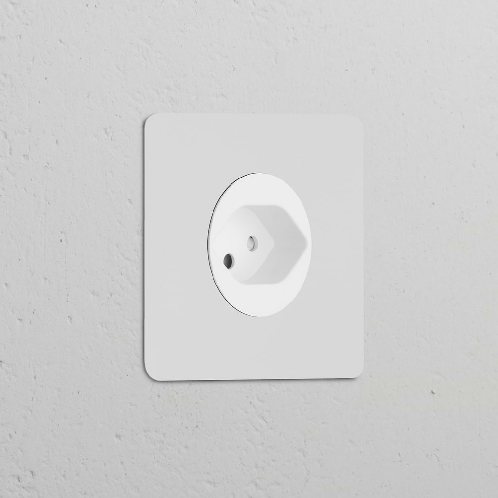Single Swiss Type J power module socket, round and paintable white, for a seamless fit in electrical installations.
