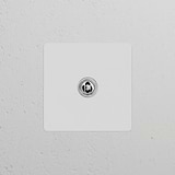 Single toggle switch (Cent) in paintable polished nickel on a textured white background. Suitable for Single Switches & Dimmers.