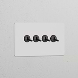 Double 4x Toggle Switch in Paintable Bronze, with four toggles on a rectangular panel for double switches & dimmers.