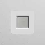Single rocker switch in polished nickel with paintable white finish, ideal for single switches & dimmers.