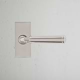 Digby Short Plate Sprung Door Handle Polished Nickel Finish on White Background Front Facing
