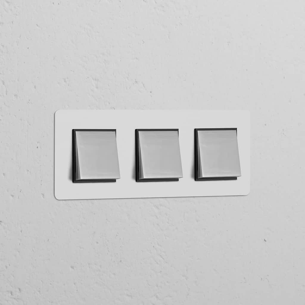 Triple 3x Rocker Switch Paintable Polished Nickel Black, modern design for Triple Switches & Dimmers on a white wall.
