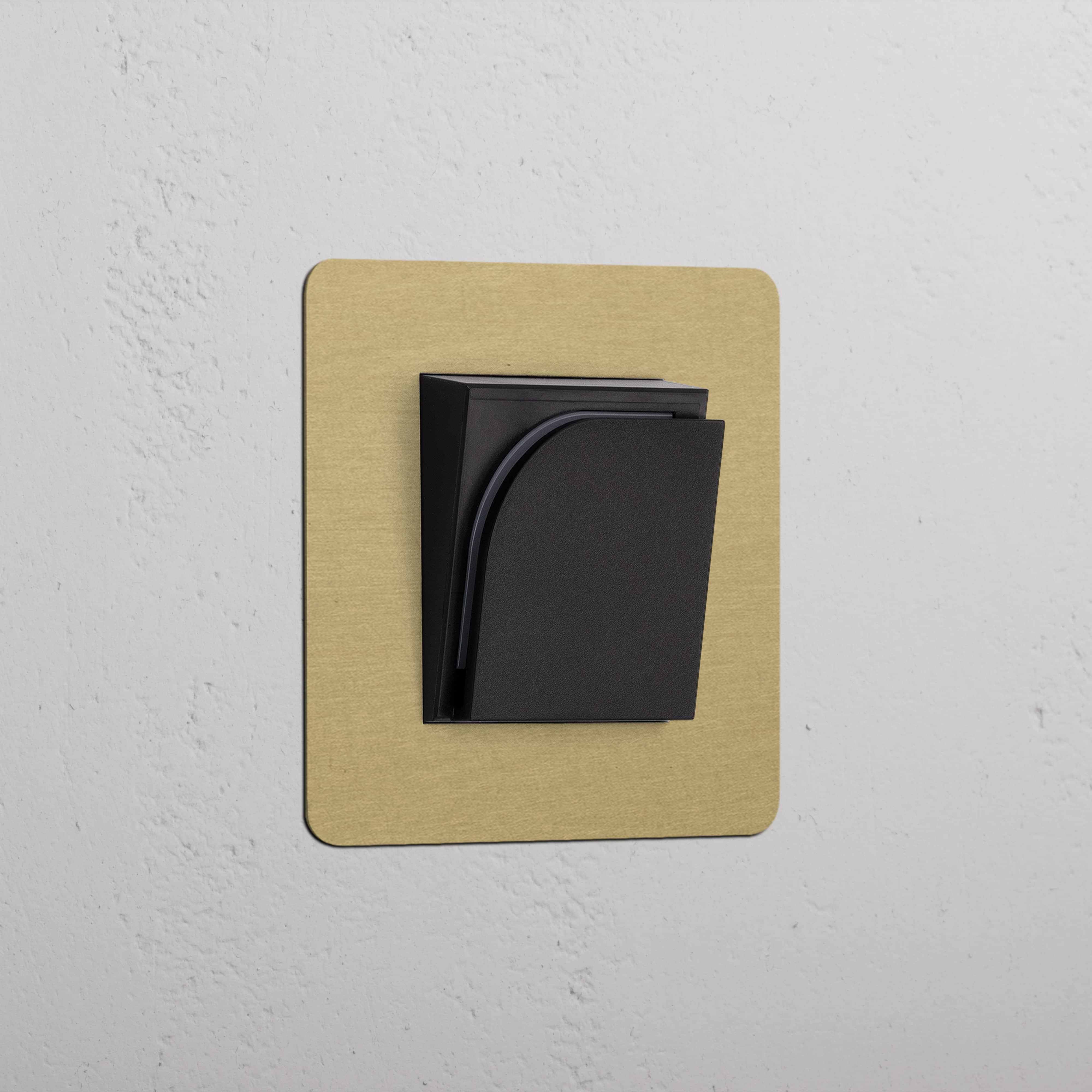 Antique brass black hotel key card switch on a textured white wall, part of the Single Sockets & Modules range.