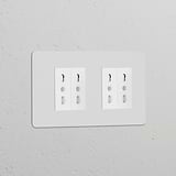 Double 4x Bipasso Power Module, paintable white, featuring a double socket with dual three-hole plug sets.