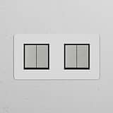 Double 4x Rocker Switch in paintable polished nickel black, ideal for modern lighting control.