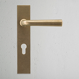 Apsley Long Plate Sprung Door Handle & Euro Lock Antique Brass Finish on White Background Front Facing