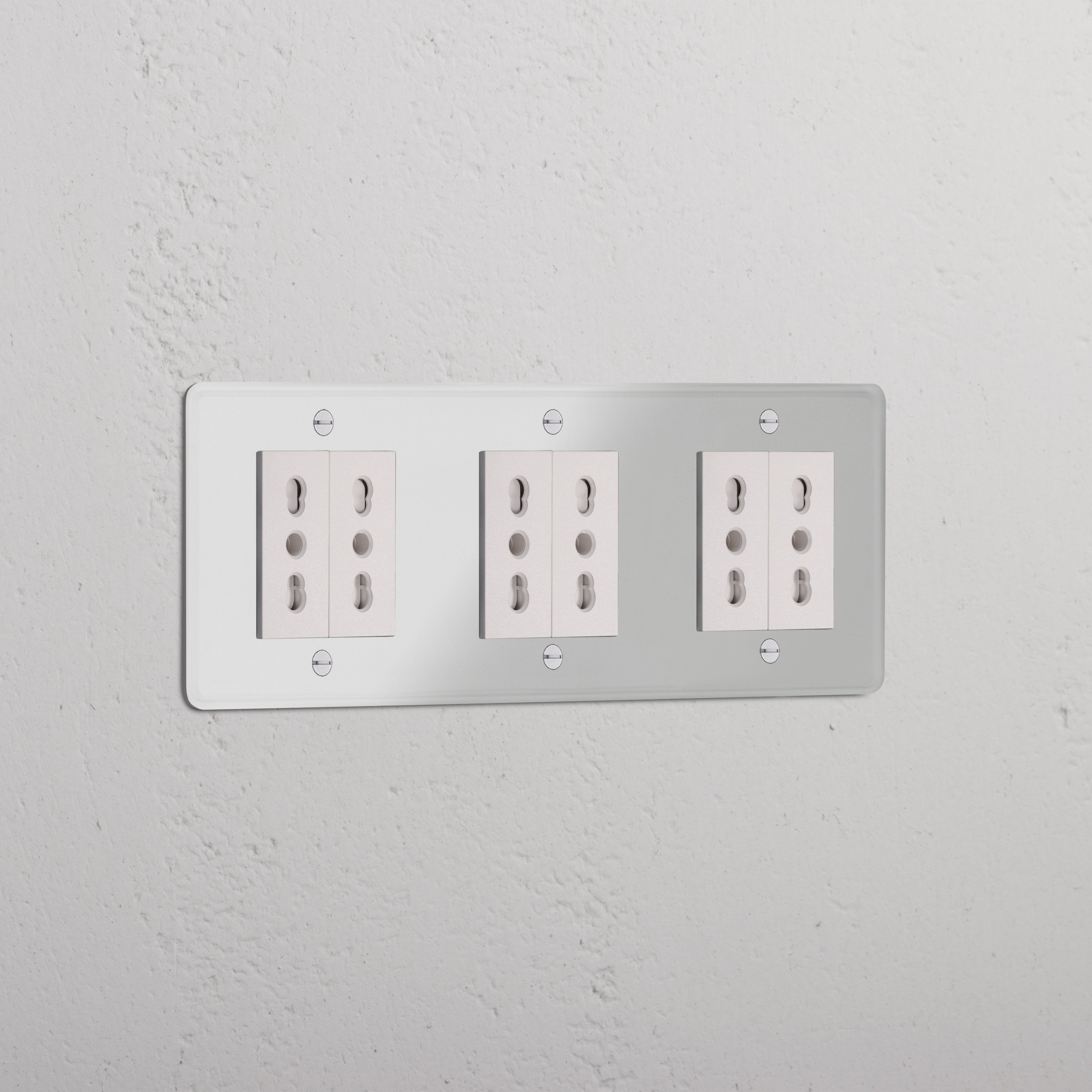 Triple 6x Bipasso Module - Clear White, triple electrical sockets on a clear white textured wall.