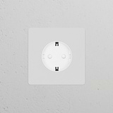 Paintable white Schuko Type F power module, single socket design, blends discreetly with the wall for functionality.