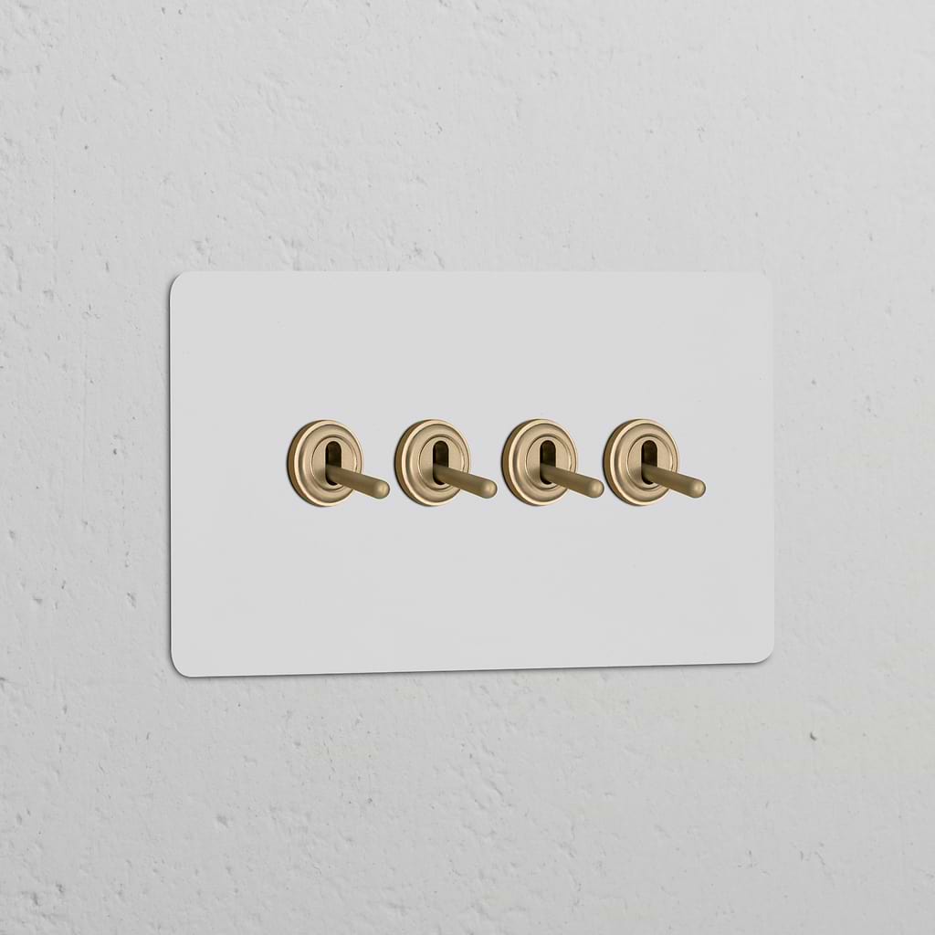 Double 4x Toggle Switch with antique brass toggles on a white panel, suited for Double Switches & Dimmers.