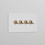 Double 4x Toggle Switch with antique brass toggles on a white panel, suited for Double Switches & Dimmers.