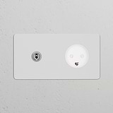 Double Toggle Switch + Danish Type K Power Module, polished nickel finish, paintable white on light-colored wall.