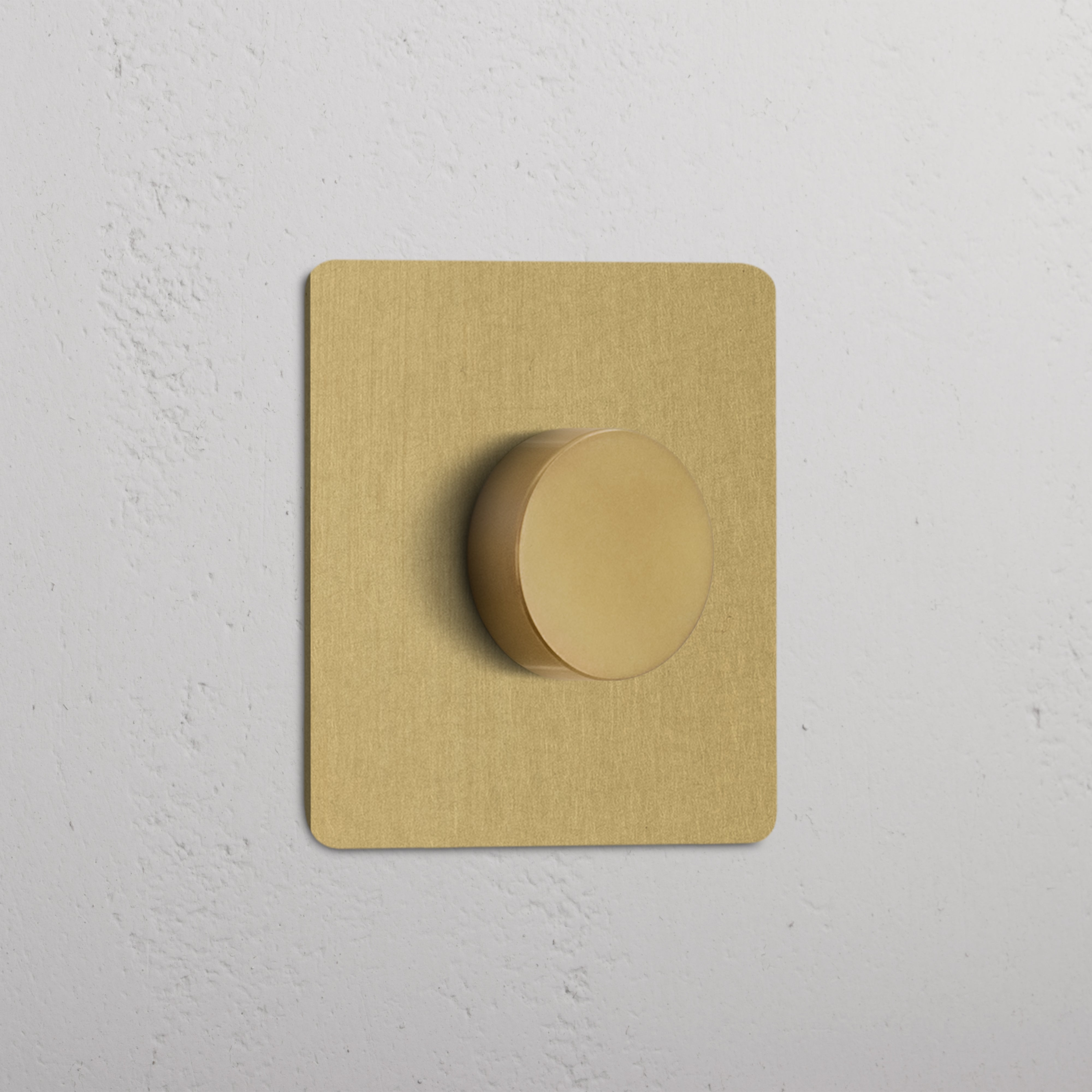 Antique Brass Single Multiway Dimmer Switch with round knob and square backplate on a white wall.