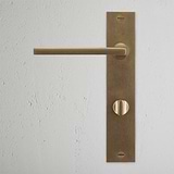 Clayton Long Plate Sprung Door Handle & Thumbturn Antique Brass Finish on White Background right Facing Front View